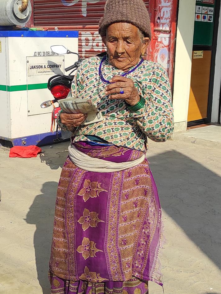 Elderly woman with cash in her hands