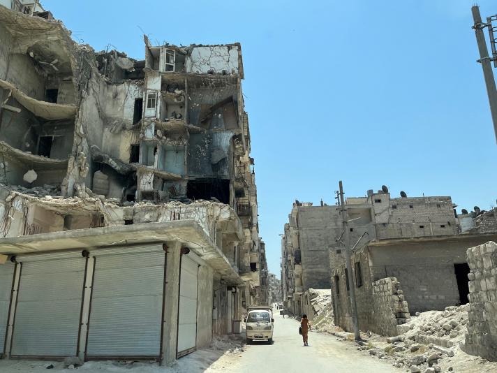 View of a street with damaged buildings due to bombardments