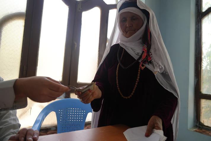 Woman in an office receiving vouchers