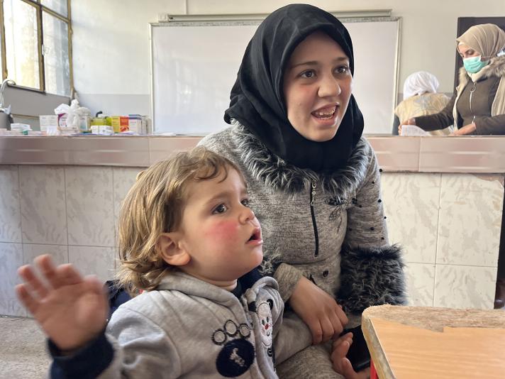 Fatima and her son inside a clinic