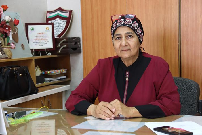Photo of principal Blance Omar sitting at a desk.