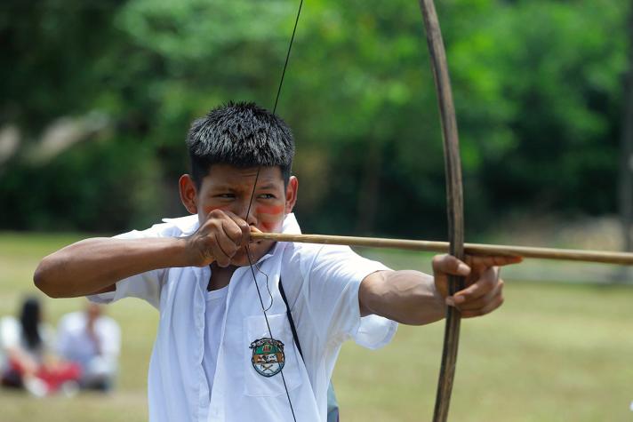 Harold holding a bow and arrow, ready to aim.