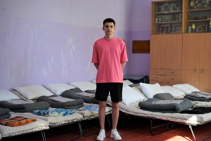 Photo of Philip in a dormroom.