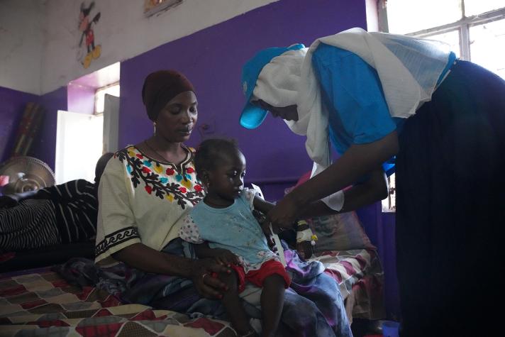 2-year-old Fatima is screened for malnutrition