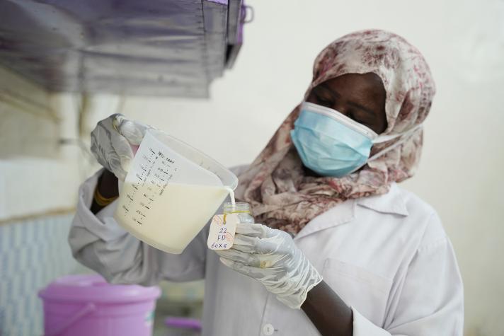 A health worker prepares therapeutic milk