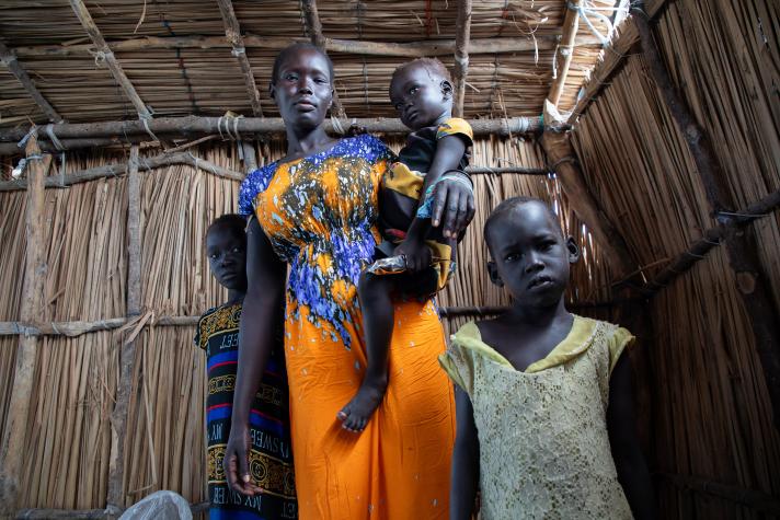 Angelina with her daughter Chaudiel (4), her youngest child Nyachar (3) (in her arms), and her daughter Nyaruot (6).