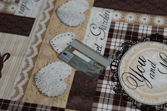 A payment card on a table decorated with a flower like table cloth.