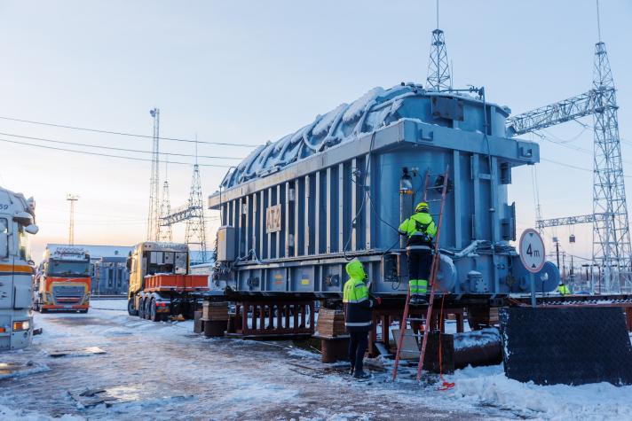 A generator on a truck in a snowy landscape.