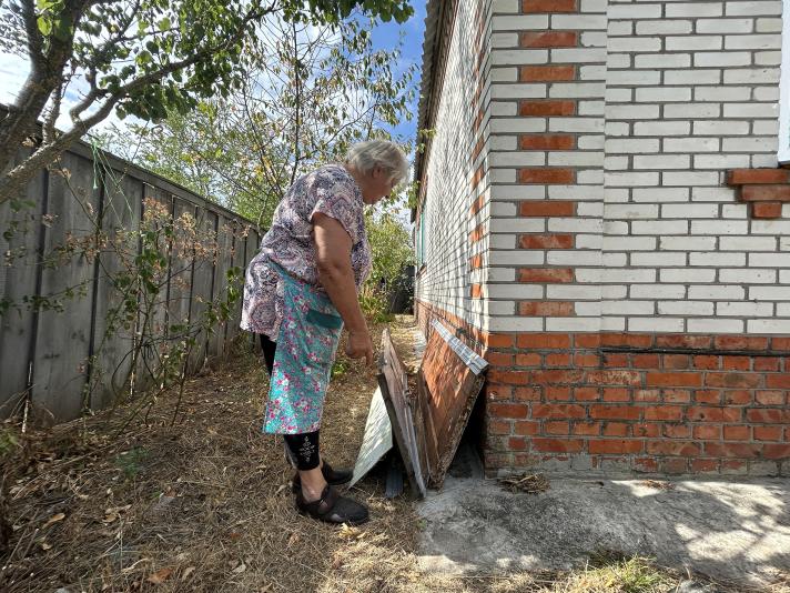 Paraskoviia showing the old front door which was put against a wall.