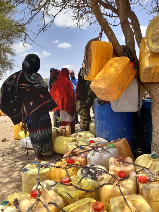 Oromia women waiting for water to be trucked in.