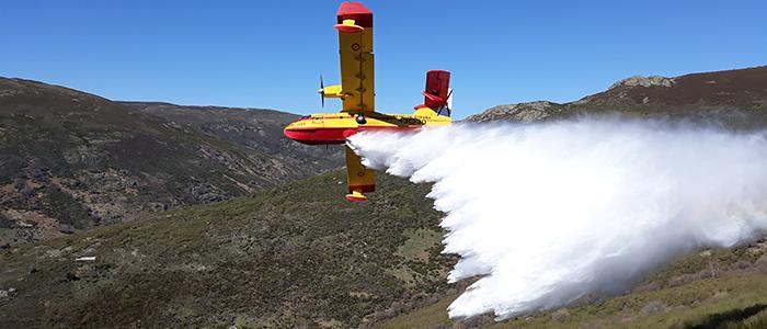 Wild fire plane over mountains