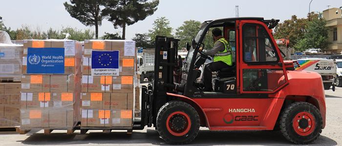 Fork lift truck carying goods with a EU flag sticker