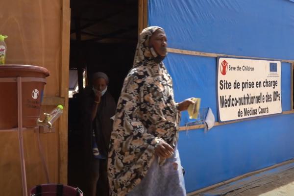 woman leaving mobile health facility