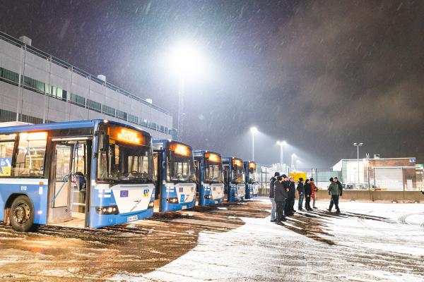 School busses lined up in the snow