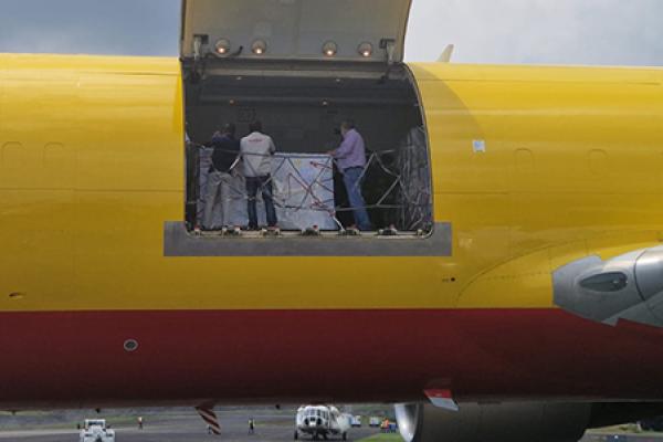 View of an open side door of a yellow plane