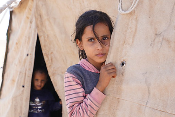 Two children in their family shelter at Rawdhan displacement site, in Marib Al-Wadi district, Yemen. 